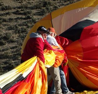 Telluride Express guests help put away their hot air balloon with San Juan Balloon Adventures