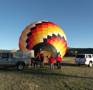 San Juan Balloon Adventures guests watch inflation of balloon in Ridgway